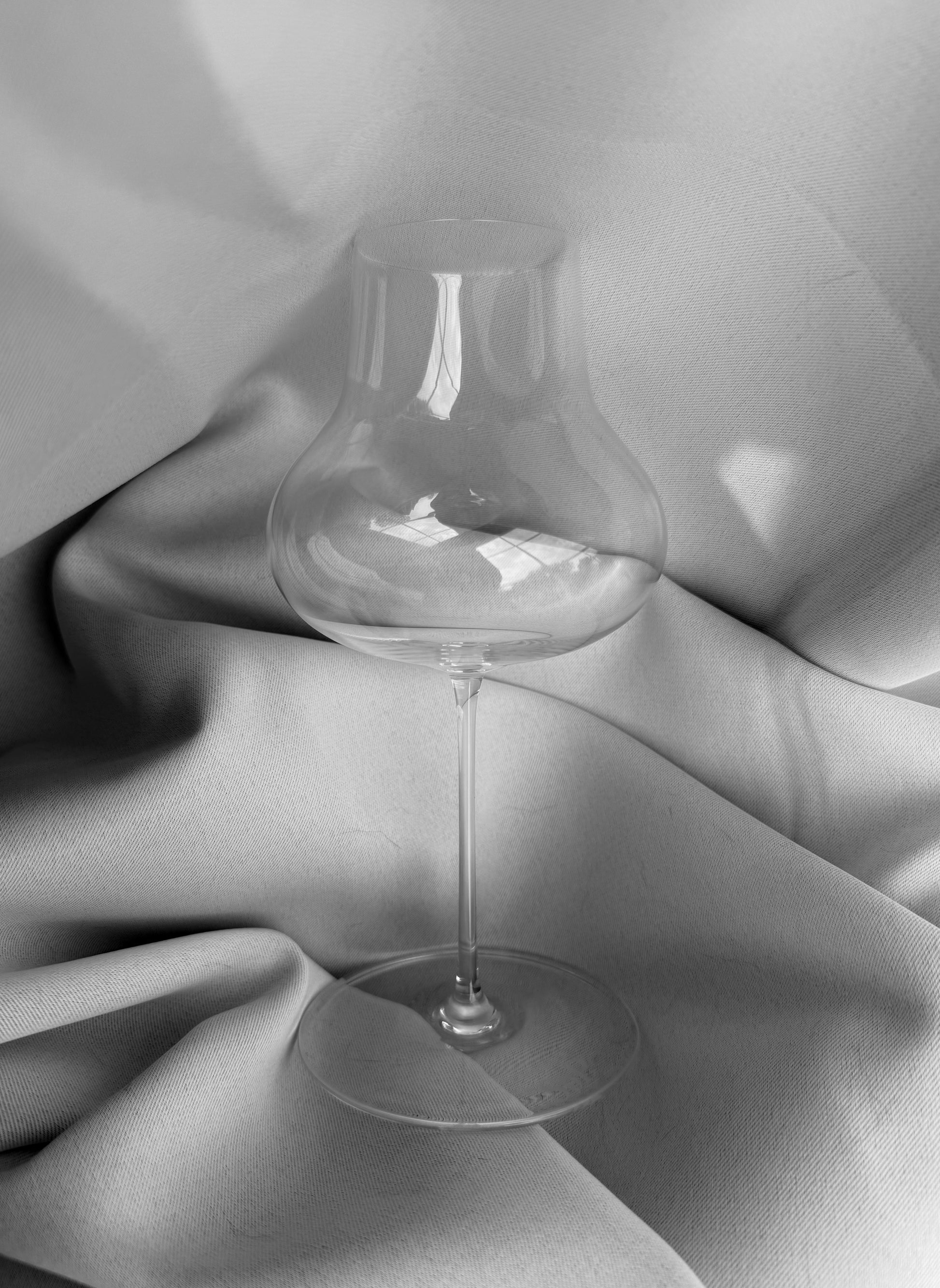 A featherlight, hand-blown lead-free crystal, universal wine glass like a Zalto, Reidel, Glasvin, Grassl, or Spiegelau.