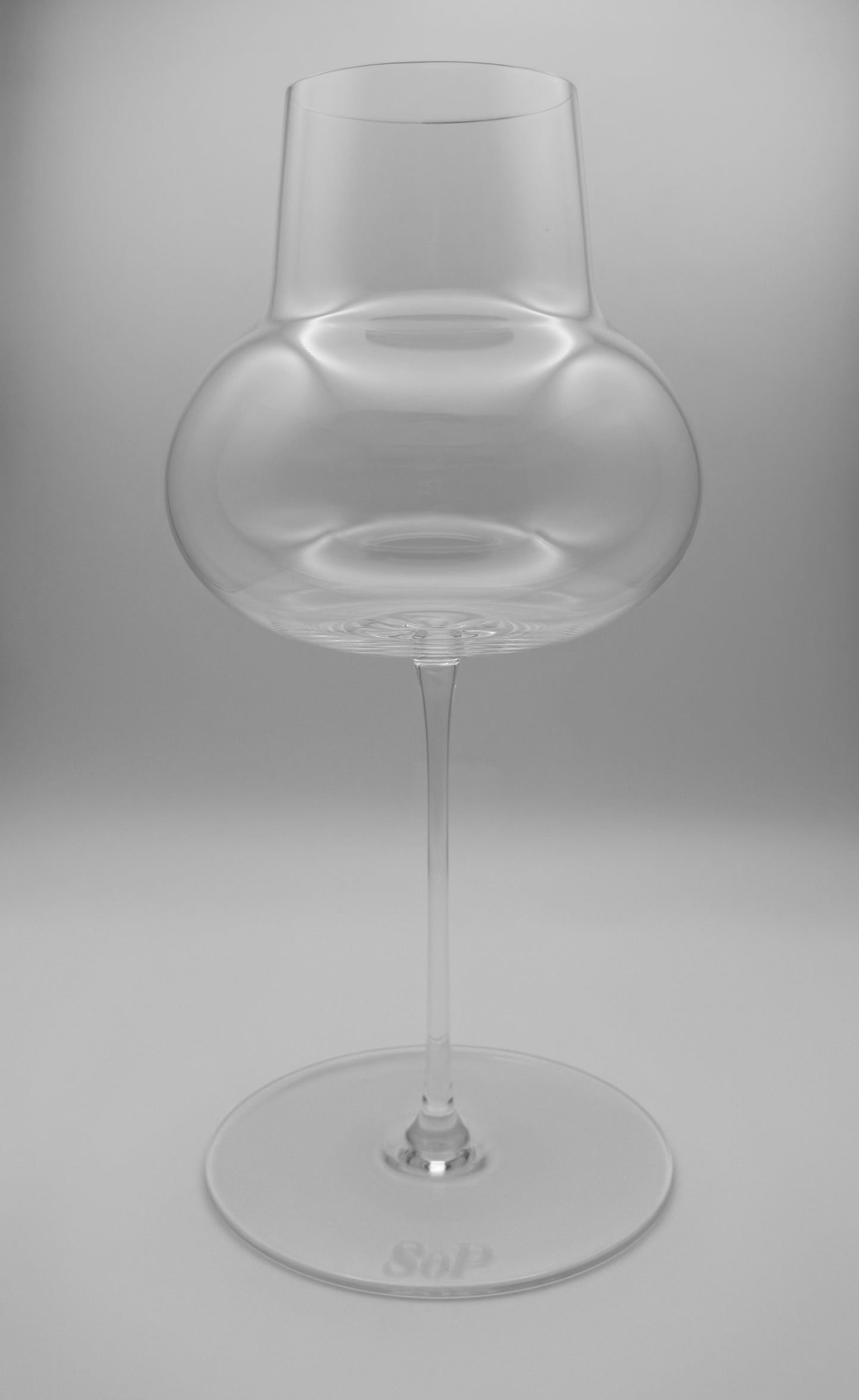 An ultra-thin but durable and dishwasher-safe, hand-blown lead-free crystal, universal wine glass like a Zalto, Reidel, Glasvin, Grassl, or Spiegelau.